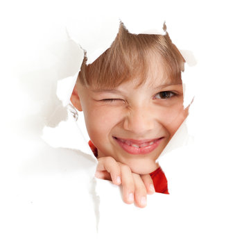 Funny Kid With Wink Eye Portrait In Torn Paper Hole Isolated