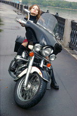 Fototapeta na wymiar Beautiful woman with motorcycle in the street