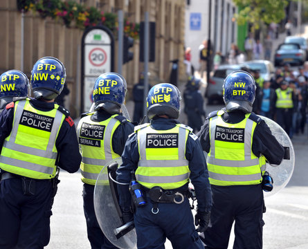 Rear view of police officers at EDL demonstration in Halifax
