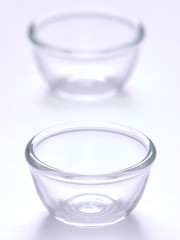 close up of a pair of glass bowls