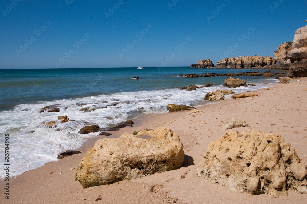 Wall mural rocky algarve shoreline