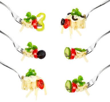 Pasta on a fork over white background