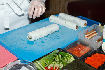 chef preparing sushi in the kitchen