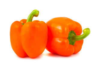 Two ripe orange peppers