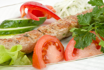 Grilled meat with fresh vegetables and herbs