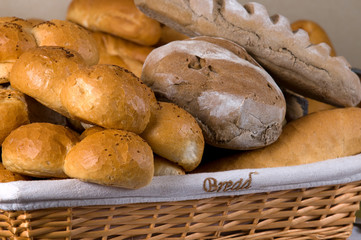 Assortment of baked bread in basket.