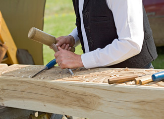 Traditional craftsman carving wood