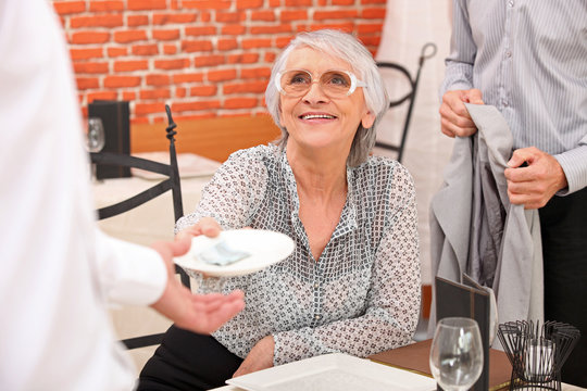 Woman paying bill