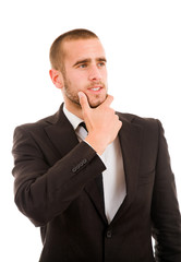 Portrait of a pensive young business man over white background
