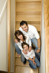 Family portrait sitting on their steps