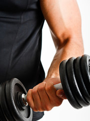 Fototapeta na wymiar Athlete lifting weights