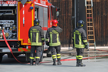 firefighters during a training exercise in their fire station