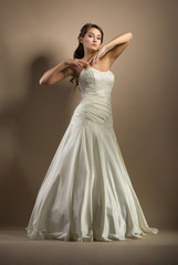 Fototapeta premium The beautiful young woman in a wedding dress