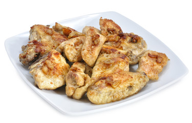 Ración de pollo al ajillo.