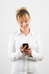 Happy smiling successful businesswoman with cell phone