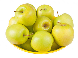 Bowl of Golden Delicious eating apples, in bowl, isolated over w
