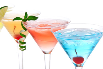 Martini alcohol cocktails in row blue hawaiian, tequila sunrise
