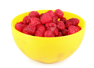 fresh raspberries in a bowl isolated on white
