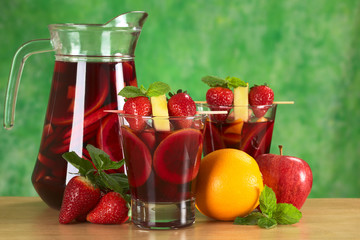 Refreshing red wine punch called sangria mixed with orange