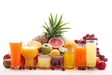 Glasses of fruit juice with fruits