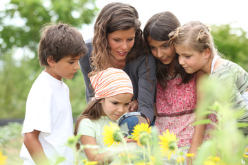 children having a nature class in the park