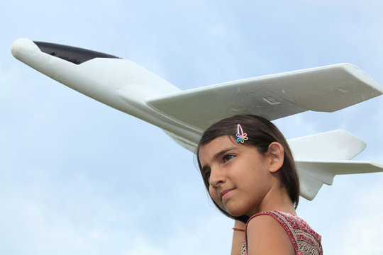 Portrait Of A Girl Holding Model Plane