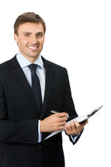 Happy businessman with clipboard writing, isolated on white