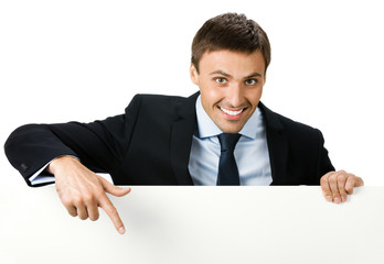 Happy business man showing blank signboard, isolated