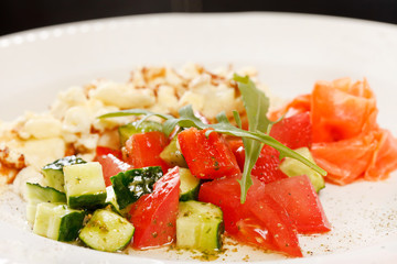 Scrambled eggs with salmon and vegetables
