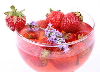 Jelly with strawberries decorated with a lavender twig