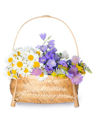 Fototapeta na wymiar Beautiful flowers in a basket isolated on white