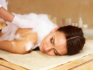 Massage of woman in beauty spa. - obrazy, fototapety, plakaty