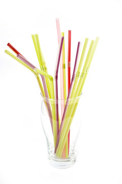 plastic drinking straws in glass