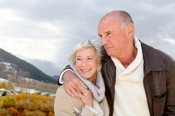 Portrait of happy senior couple at the mountain