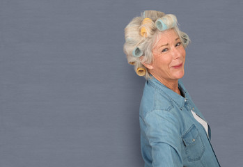 Portrait of senior woman with hair curlers