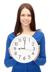 woman holding big clock