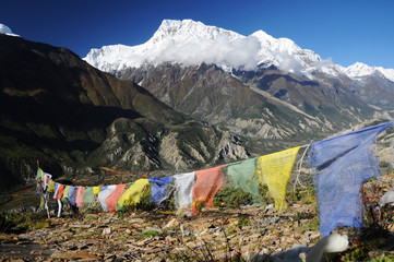 Annapurna peak with colorful prayer flags, Nepal
