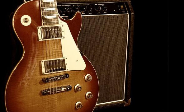 Electric Guitar With Amplifier Isolated on Black Background