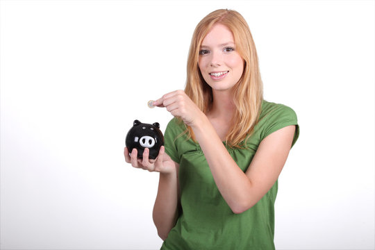 portrait of a young woman with money box
