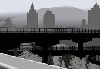 bridge in grey city near mountain