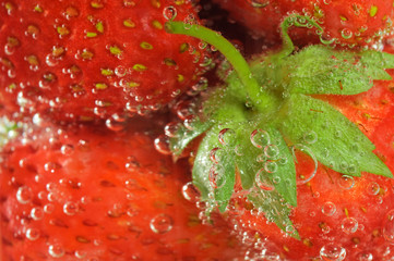 strawberry on soda glass