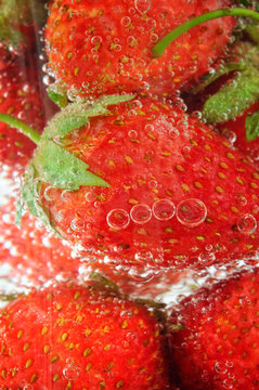 strawberry on soda glass