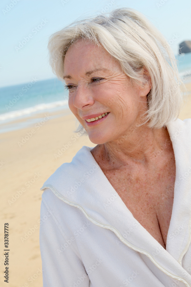 Wall mural Portrait of happy senior woman in spa resort