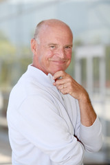 Portrait of handsome senior man with blue sweater