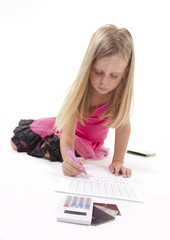 Little girl drawing on a spreadsheet