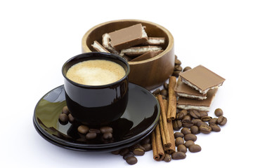 cup of italian espresso with cinnamon, coffee beans and chocolat