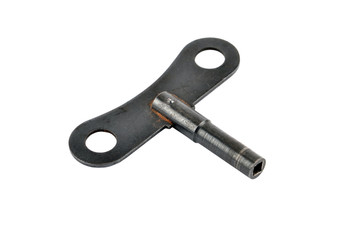 Old vintage rusty key for clock, isolated on white background