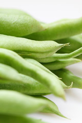 Geen beans on white background, close-up.