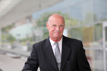 Fototapeta premium Portrait of smiling mature businessman