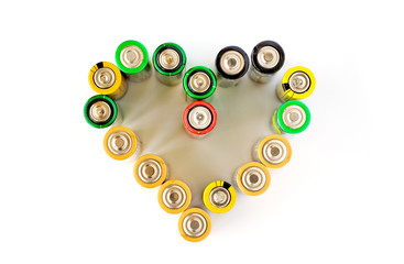 A heart made from AA batteries on the white background